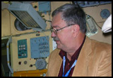 (Sep 26) Examining SFOG canister (‘Solid Fuel Oxygen Generator’) inside Mir mockup at ‘Gagarin Cosmonaut Training Center’. A unit like this one malfunctioned in February 1997 and nearly killed six crewmen, including a visiting american astronaut.
